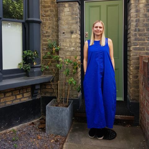 Woman standing doorstep 